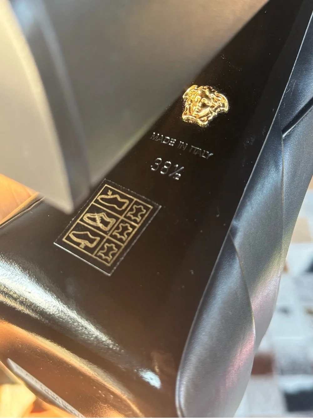 Versace Black Leather Platform Ankle Boots with Gold Accents